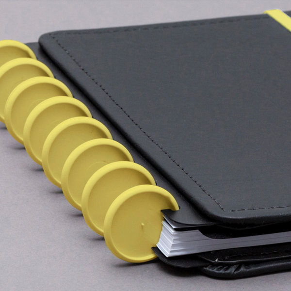 Discos e elástico amarelo cerrado para o Caderno Inteligente